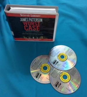 audiobook case standing, with 3 discs on table in front