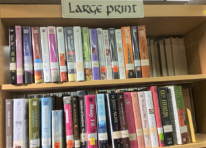 shelf full of books with a &quot;Large Print&quot; label on top
